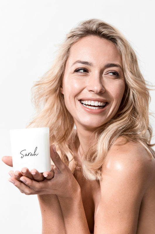 blonde model with personalised name candle for her