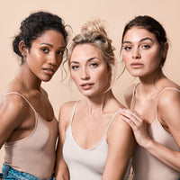 three young models wearing skin colour singlets 