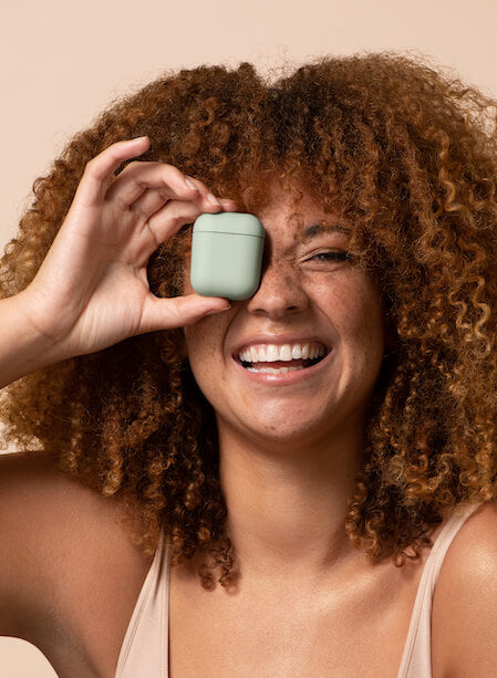 woman with airpods case