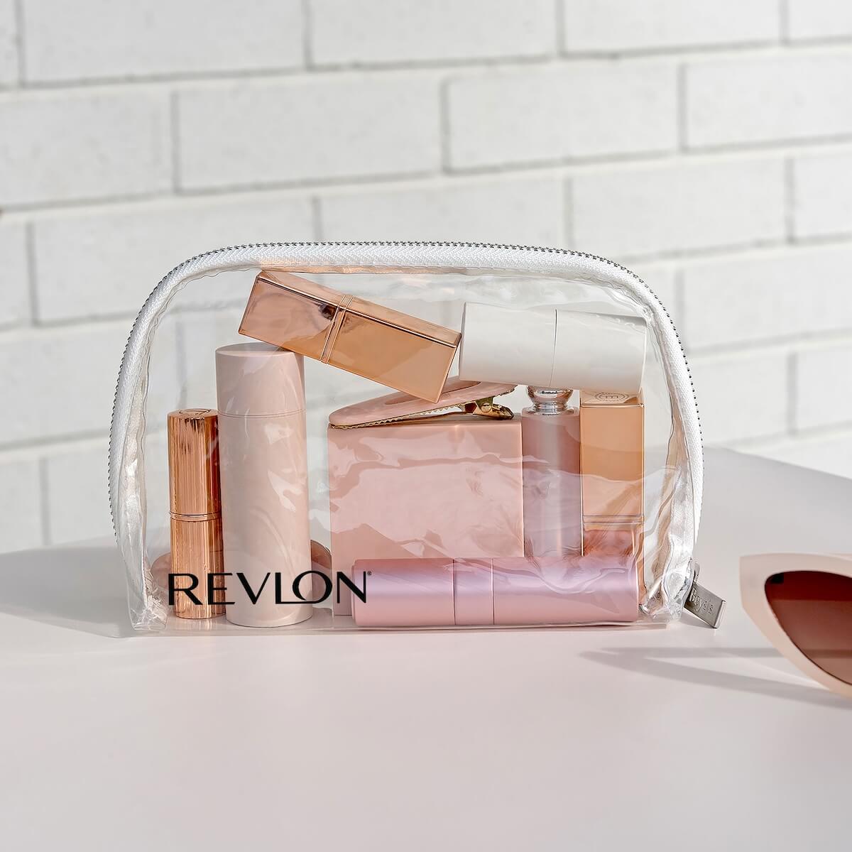 Beysis clear waterproof makeup bag branded with a company logo, filled with makeup beside sunglasses