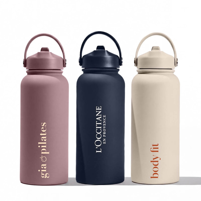 Beysis 900ml stainless steel straw water bottles in mauve, navy and stone, each branded with a different company logo